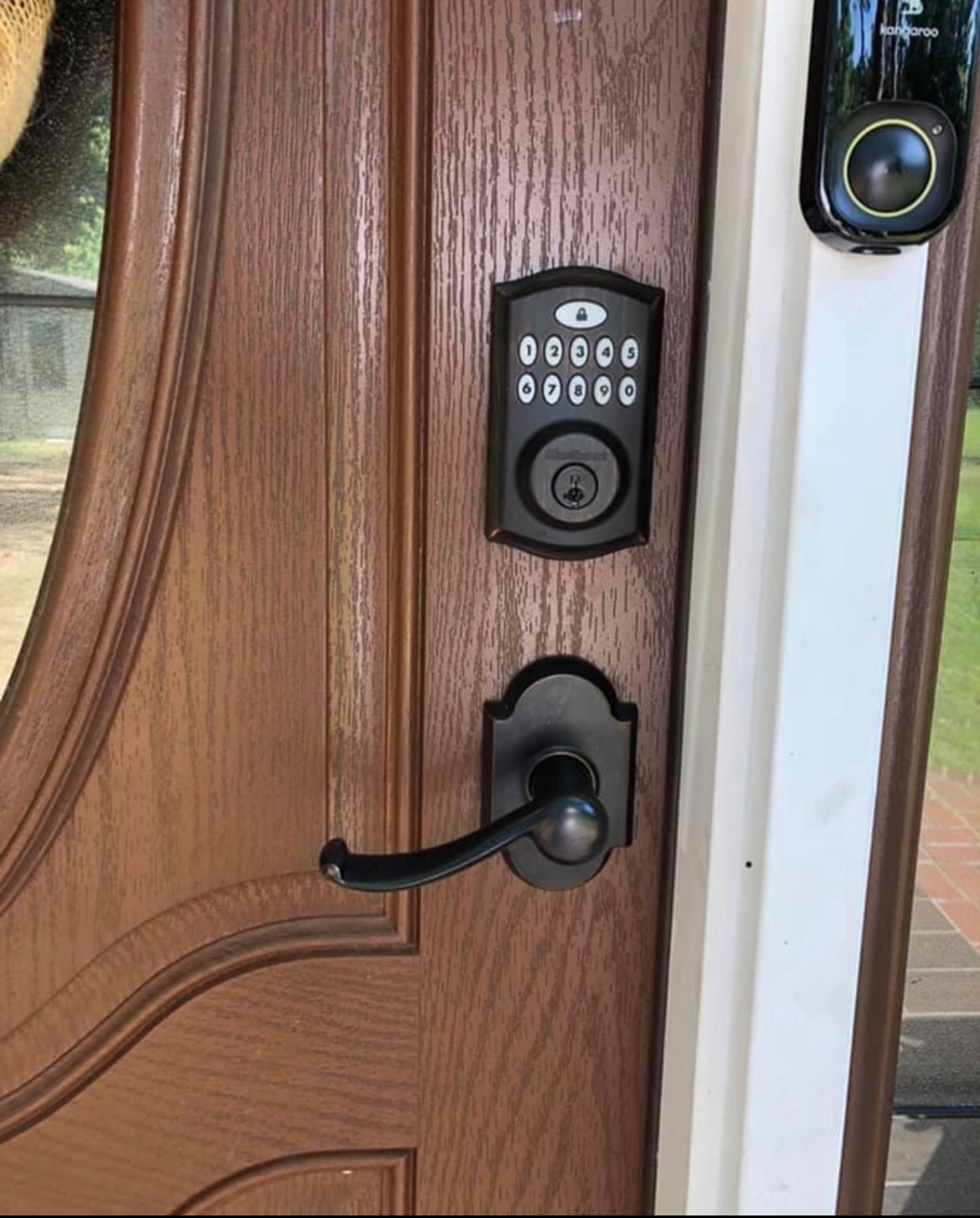 Smart keypad deadbolt installed on a residential front door